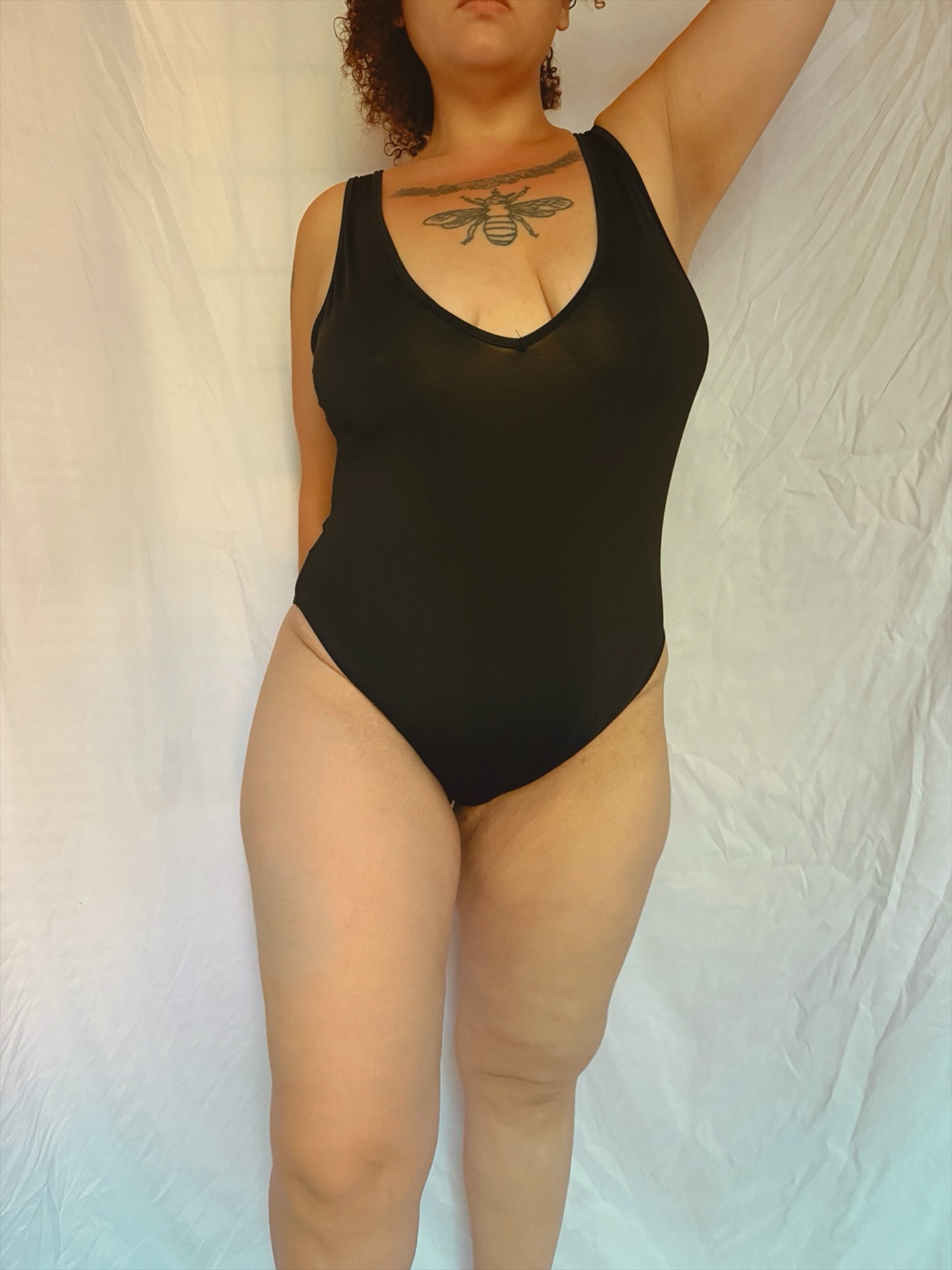 Cleo in a black bodysuit